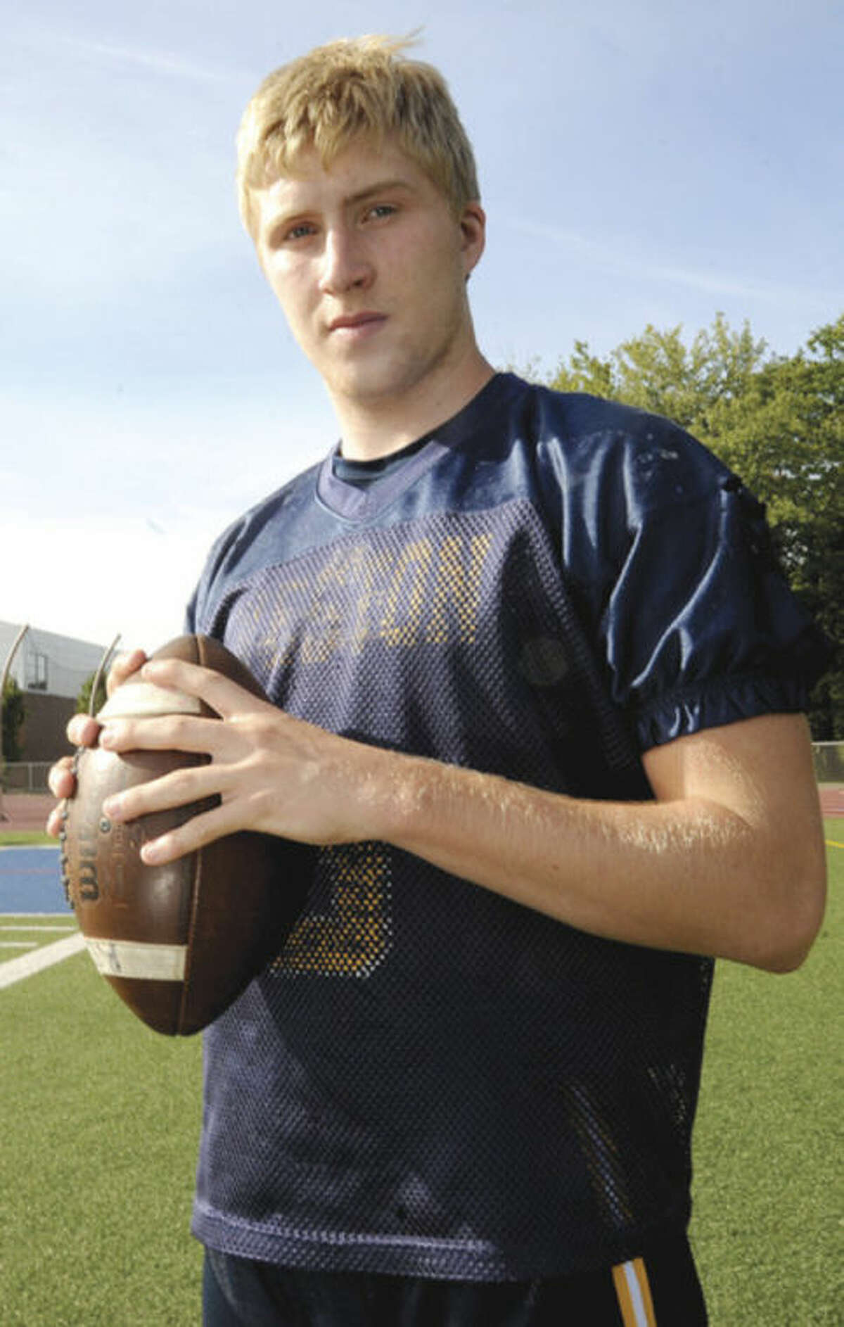 Hour photo/Matthew Vinci Erik Dammen-Brower takes over the quarterback duties at Weston High School, replacing one of the Trojans' best-ever signal callers in the process.