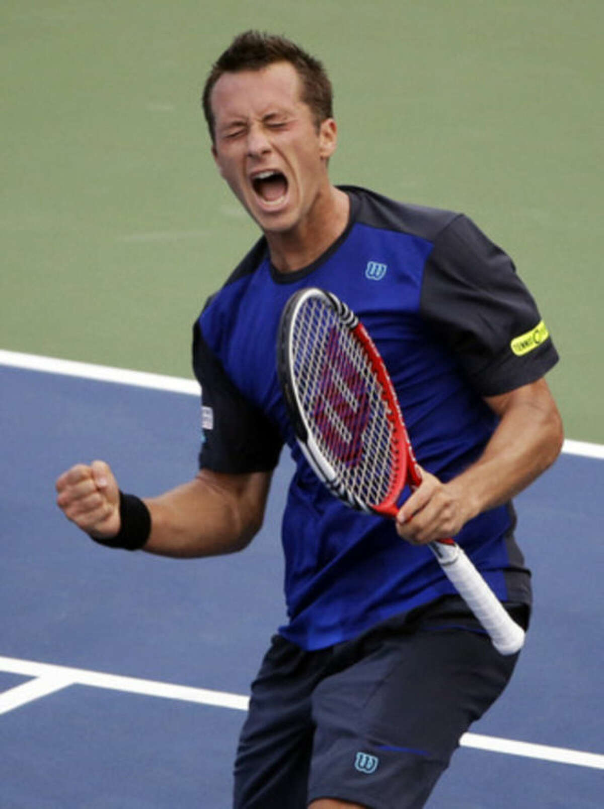 Philipp Kohlschreiber, of Germany, celebrates after beating John Isner during the third round of the 2013 U.S. Open tennis tournament, Saturday, Aug. 31, 2013, in New York. (AP Photo/David Goldman)