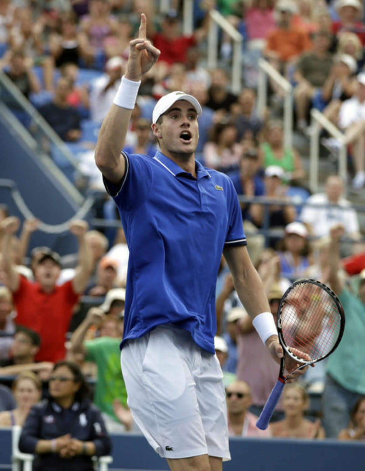 John Isner reacts after a point against Philipp Kohlschreiber, of Germany, during the third round of the 2013 U.S. Open tennis tournament, Saturday, Aug. 31, 2013, in New York. (AP Photo/Darron Cummings)
