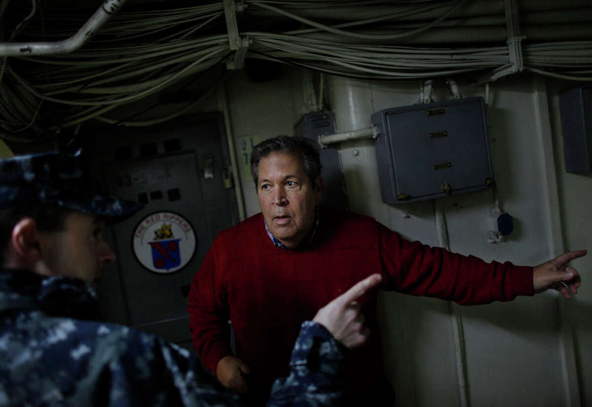 Bob Lewis tries to find his old quarters aboard the USS Enterprise during a tour of the ship Friday, Nov. 30, 2012, in Norfolk, Va. Lewis was an A-4 Skyhawk fighter pilot during the Vietnam War who flew 219 combat missions from The Big E. (AP Photo/The Virginian-Pilot, Stephen M. Katz) MAGS OUT
