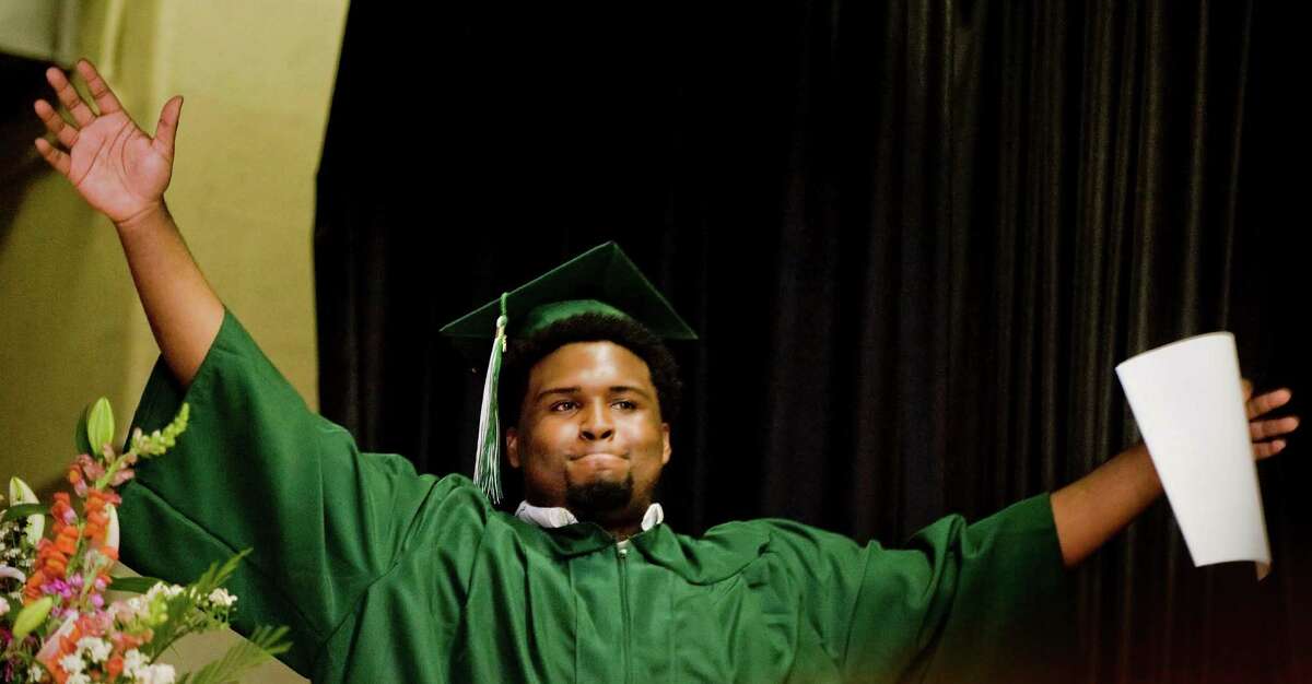 Stamford Academy graduate Jamere Brutus celebrates during the graduation ceremony held at Trailblazers Academy in Stamford. Wednesday, June 15, 2016