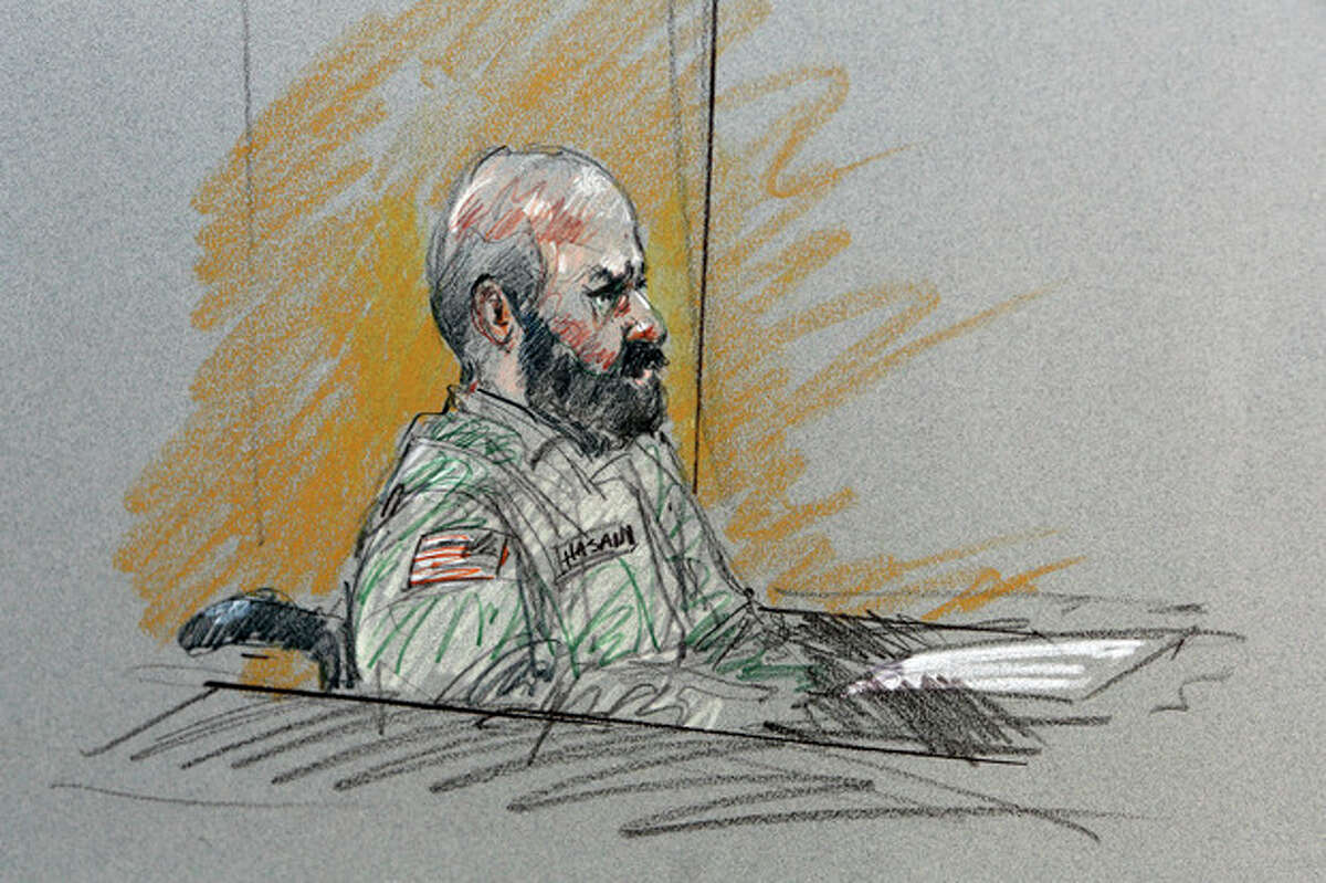 FILE- In this Aug. 6, 2013, file courtroom sketch, Maj. Nidal Malik Hasan sits in court for his court-martial in Fort Hood, Texas. The prosecutors pursuing the death penalty against the Army psychiatrist accused in the 2009 Fort Hood shooting rampage will soon begin trying to answer a difficult but key question_ determining why Hasan attacked his fellow soldiers in the worst mass shooting ever on a U.S. military base. (AP Photo/Brigitte Woosley, File)