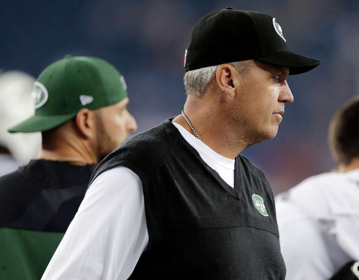 New York Jets coach Rex Ryan watches his team warm up before an NFL football game against the New England Patriots on Thursday, Sept. 12, 2013, in Foxborough, Mass. (AP Photo/Charles Krupa)