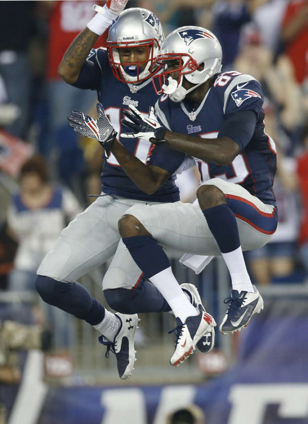 New England Patriots wide receiver Aaron Dobson (17) celebrates his touchdown against the New York Jets with wide receiver Kenbrell Thompkins, right, in the first quarter an NFL football game Thursday, Sept. 12, 2013, in Foxborough, Mass. (AP Photo/Elise Amendola)