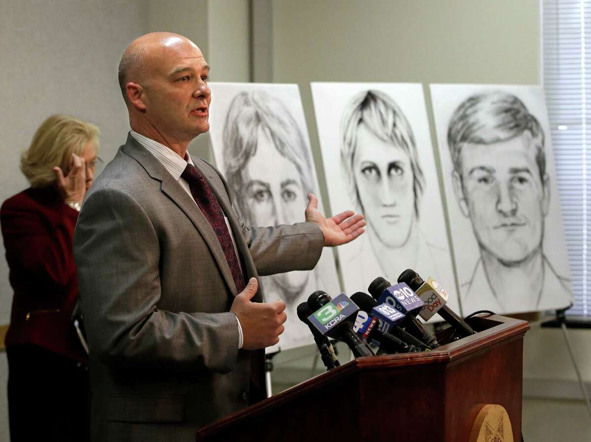 Sgt. Paul Belli, of the Sacramento County Sheriff's Department homicide bureau, gestures toward law enforcement drawings of a suspected serial killer believed to have committed at least 12 murders across California in the 1970's and 1980's at a news conference Wednesday, June 15, 2016, in Sacramento, Calif. Authorities announced a $50,000 reward for the arrest and conviction of the person that along with murder, is suspected of committing at least 45 rapes and dozens of burglaries. (AP Photo/Rich Pedroncelli)