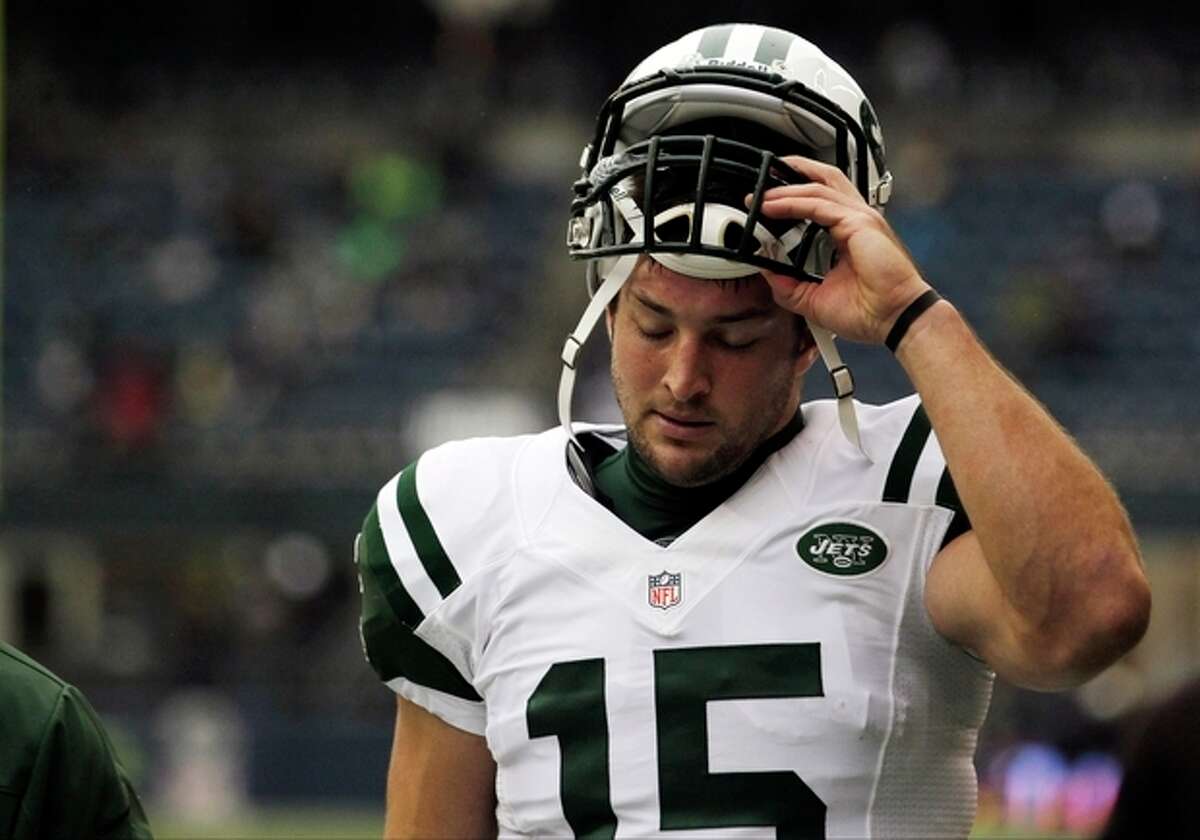 FILE - This Nov. 11, 2012 file photo shows New York Jets' Tim Tebow on the field before an NFL football game against the Seattle Seahawksin Seattle. Rex Ryan acknowledged Wednesday, Dec. 19, 2012 that he had higher expectations for the seldom-used Tebow in the Jets' wildcat-style offense. And, so did the NFL's most popular and maligned backup quarterback. (AP Photo/Elaine Thompson, File)