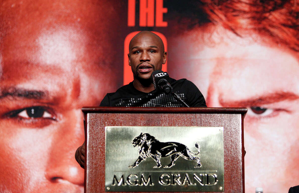 Boxer Floyd Mayweather speaks during a press conference in Las Vegas, Wednesday, Sept. 11, 2013. Mayweather is scheduled to fight on Saturday against Carnelo Alvarez, for Mayweather's WBA Super World and Alvarez's WBC junior middleweight titles. (AP Photo/Las Vegas Review-Journal, John Locher) LOCAL TV OUT; LOCAL INTERNET OUT; LAS VEGAS SUN OUT