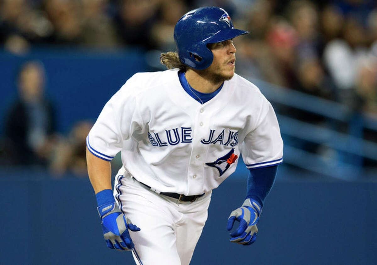 Toronto Blue Jays' Colby Rasmus watches his two run home run against the New York Yankees during the fourth inning of MLB American League baseball action in Toronto Wednesday, Sept. 18, 2013. (AP Photo/The Canadian Press, Mark Blinch)