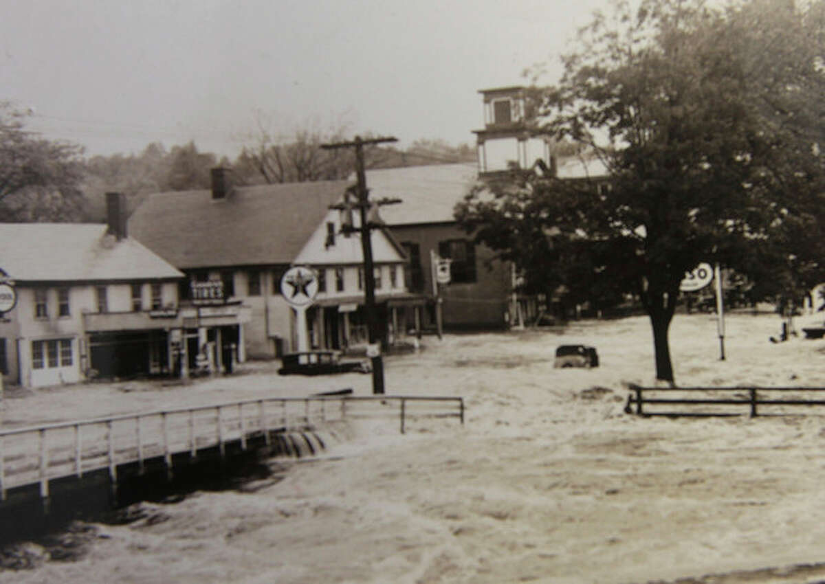 In this photo from the collection of the Monadnock Center for History and Culture, shows flood waters in the center of town in Peterborough, N.H. during the Great New England Hurricane of 1938. Sept. 21, 1938, Seventy-five years ago the hurricane was estimated to have killed between 682 and 800. It remains the most powerful and deadliest hurricane in recent New England history. (AP Photo/Monadnock Center for History and Culture)