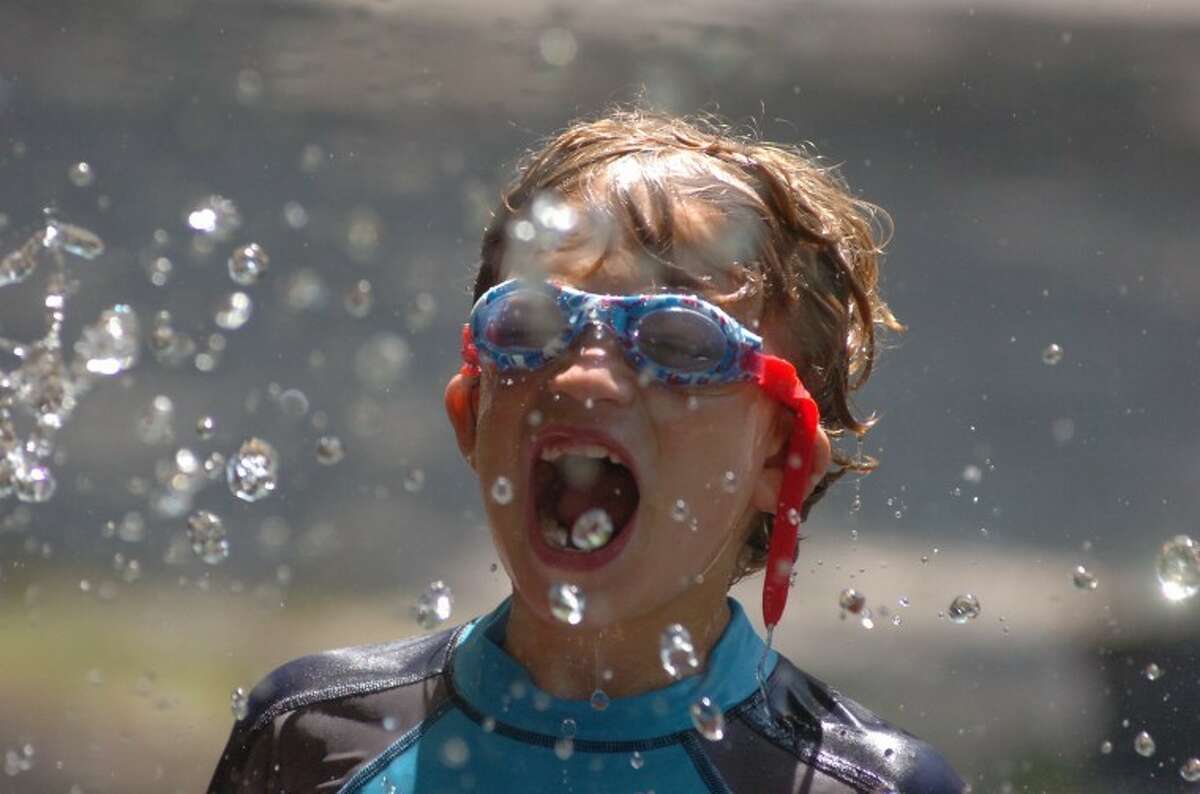 Ben Kesselman cools off during Camp Gordyland at The Wilton Family Y this summer. The Y is seeking donations to fill a $20,000 gap in funding to pay for next year's community service and outreach programs.