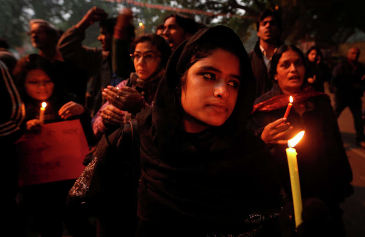 FILE - In this Dec. 26, 2012 file photo, Indians participate in a candle light vigil to seek a quick recovery of the young victim of the recent brutal gang-rape in a bus in New Delhi, India. A statement by Singapore?’s Mount Elizabeth hospital, where the 23-year-old victim was being treated, said she died Saturday, Dec. 29, 2012. (AP Photo/Saurabh Das, File)