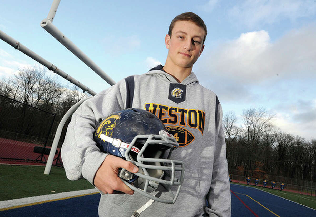 Hour photo/Matthew Vinci Weston's Tyler Hassett may be small in stature, but the senior came up big when it counted, leading the Trojans into the state playoffs for the first time in more than 20 years. A two-way performer, Hassett has been selected as the MVP on The Hour's All-Area football team.