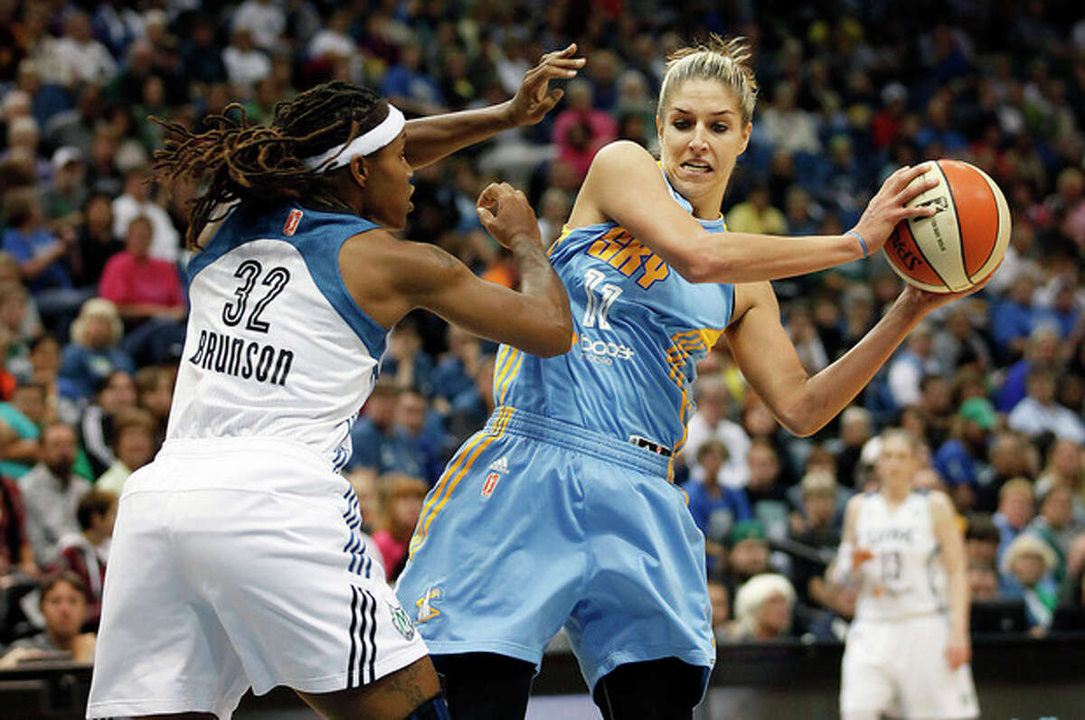 Chicago Sky guard Elena Delle Donne (11) protects the ball against Minnesota Lynx forward Rebekkah Brunson (32) in the first half of a WNBA basketball game, Saturday, Sept. 14, 2013, in Minneapolis. (AP Photo/Stacy Bengs)
