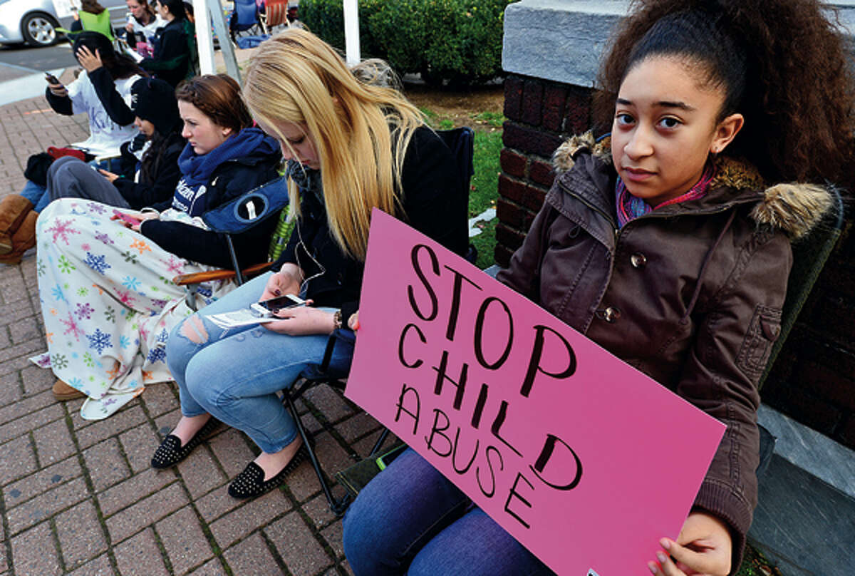 In this file photo, members of the Center for Youth Leadership, including Ayahna Santaella, participate in “Occupy Sidewalks” in front of the Norwalk Museum to raise awareness about child abuse, human trafficking, the rights of immigrants, bullying and dating violence.