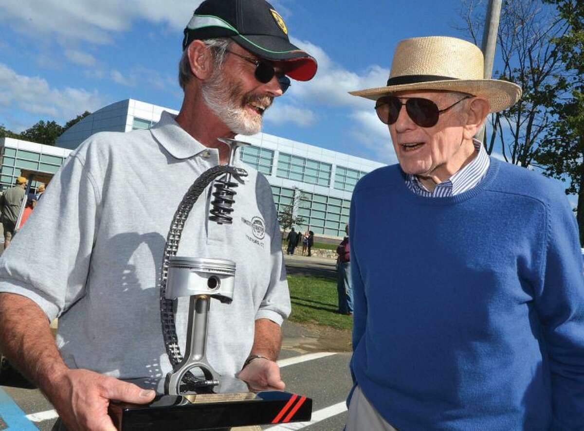 Hour Photo/Alex von Kleydorff. Automotive Restorations Project Manager Charles Webb accepts the Best in Show trophy from Alden Sherman for his client Peter Kalikow's 1962 Ferrari 400 Super America