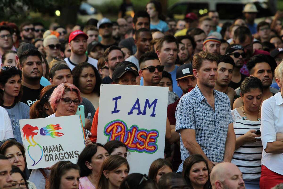 Hundreds gather for candlelight vigil in honor of 49 slain Sunday in