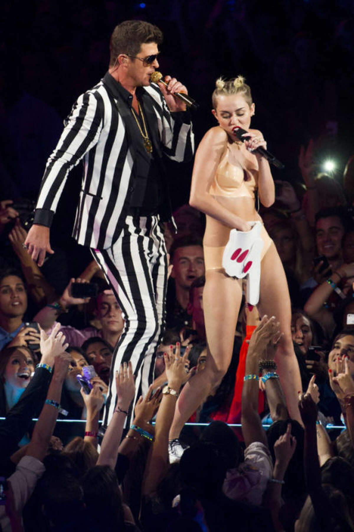 FILE - In this Aug. 25, 2013 file photo, Robin Thicke and Miley Cyrus perform at the MTV Video Music Awards at the Barclays Center in the Brooklyn borough of New York. Cyrus has been making noise for months now: It started with her edgy We Cant Stop party-style music video, but she hit new heights with her eye-popping MTV Video Music Awards performance. (Photo by Charles Sykes/Invision/AP, File)