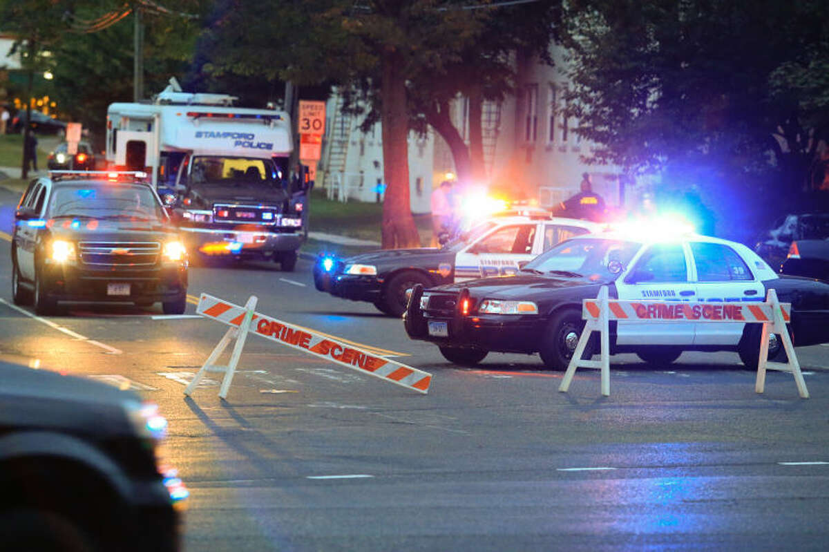 Stamford police block off Bridge Street outside of the Woodside Green condominiums thought to be the home of a woman killed by police in Washington, DC Thursday evening. Hour Photo / Chris Palermo