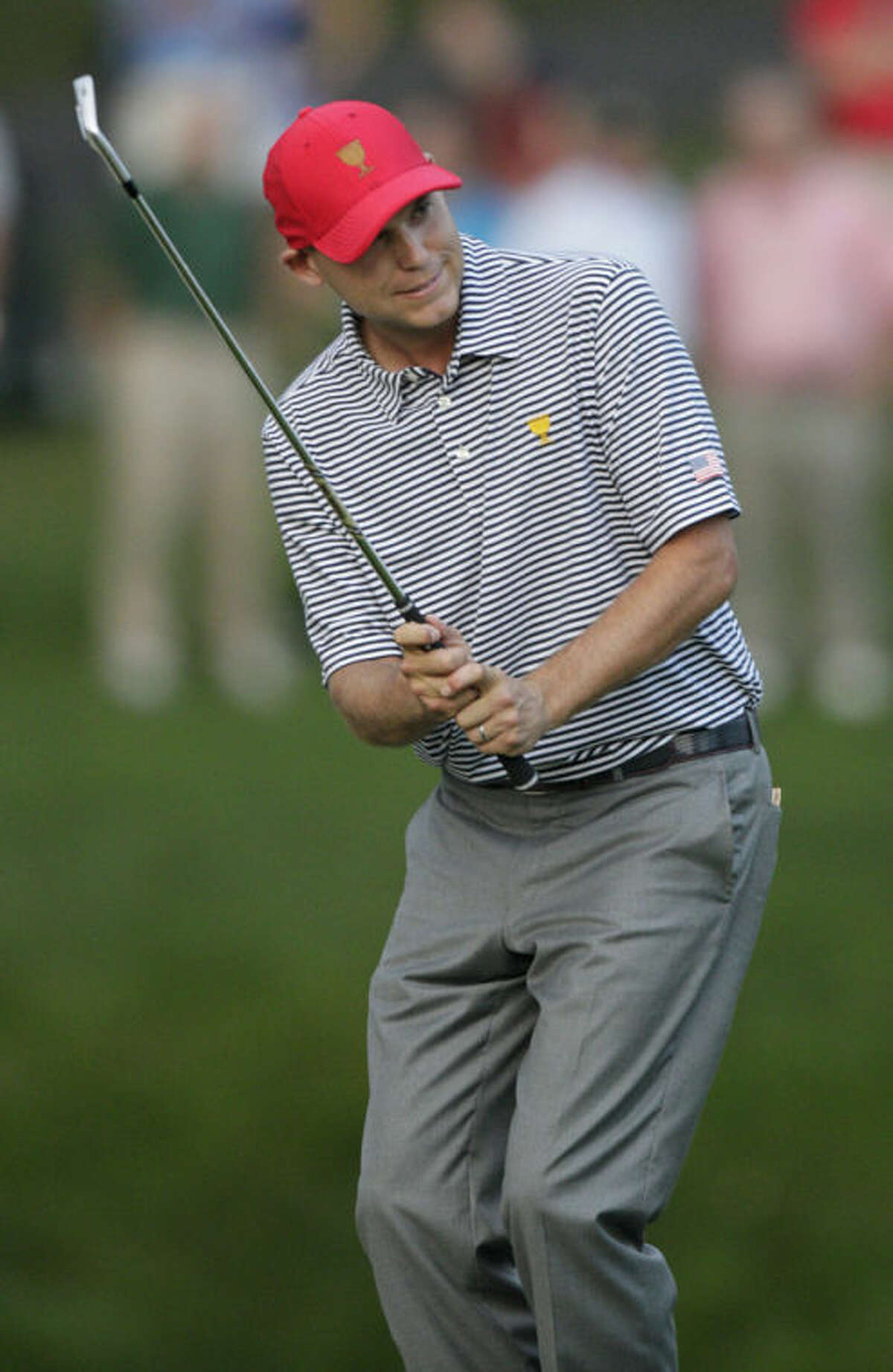 United States's Bill Haas reacts to missing a shot on the 15th hole during a foursome match at the Presidents Cup golf tournament at Muirfield Village Golf Club Friday, Oct. 4, 2013, in Dublin, Ohio. (AP Photo/Jay LaPrete)