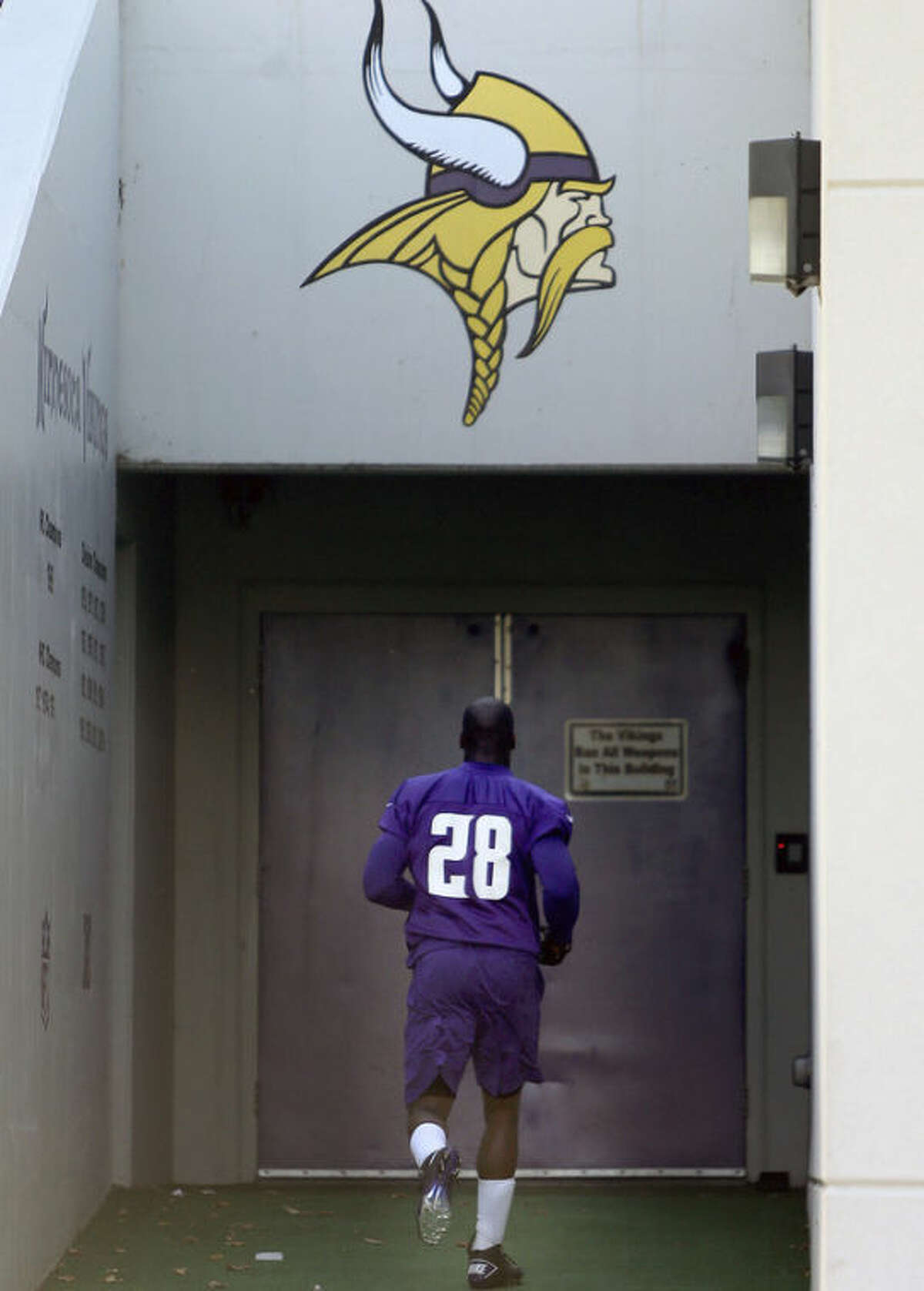 Minnesota Vikings' Adrian Peterson makes his way off an NFL football practice field at Winter Park in Eden Prairie, Minn., Friday, Oct. 11, 2013. Peterson said he is certain he will play Sunday despite a serious personal matter that caused him to miss practice earlier this week. (AP Photo/The Star Tribune, Elizabeth Flores) ST. PAUL PIONEER PRESS OUT; SOFT OUT MINNEAPOLIS-AREA TV NOT TV OUT; MAGAZINES OUT