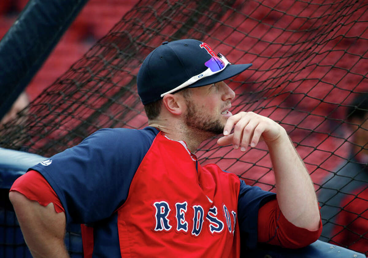 Boston Red Sox's Daniel Nava watches at the batting cage during the baseball team's workout at Fenway Park in Boston, Thursday, Oct. 10, 2013, in preparation for Game 1 of the AL championship series on Saturday. (AP Photo/Elise Amendola)