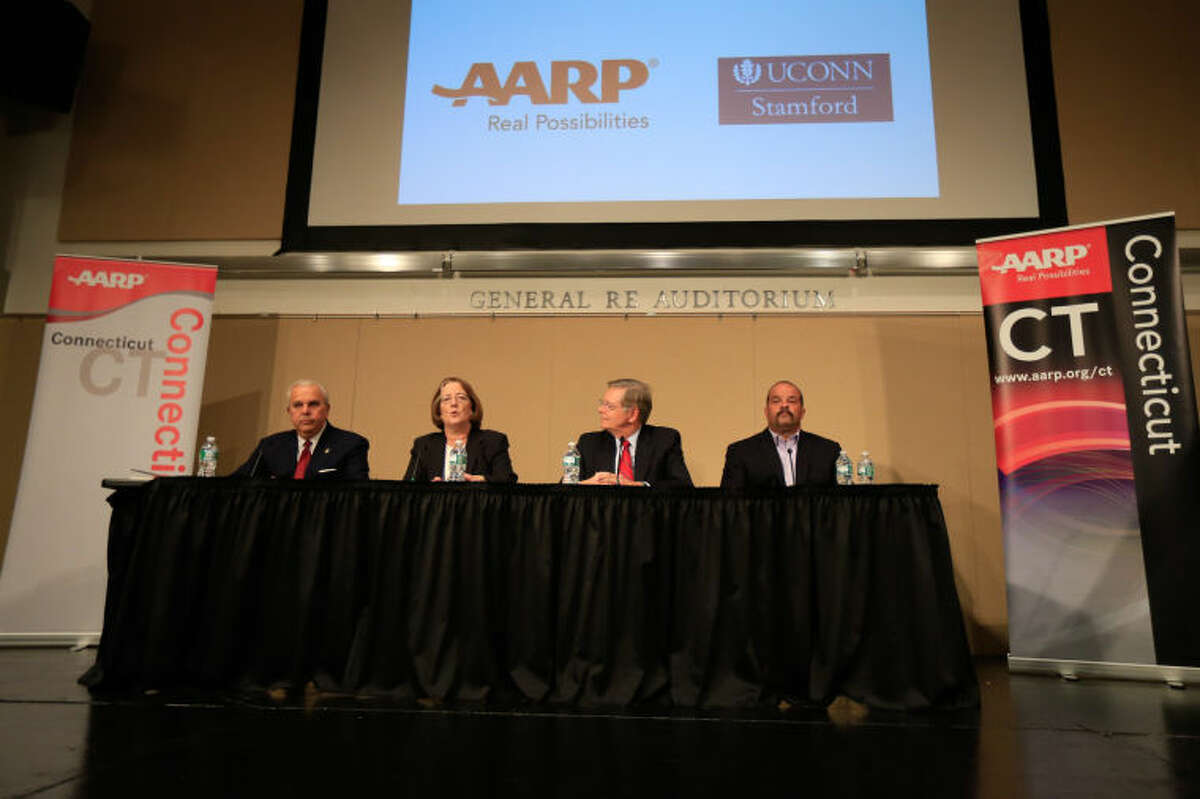 From left, Michael Fedele, Kathleen Murphy, David Martin, and John Zito speak at the AARP sponsored intergenerational Stamford Mayoral Candidate Forum at UCONN Stamford Thursday night.