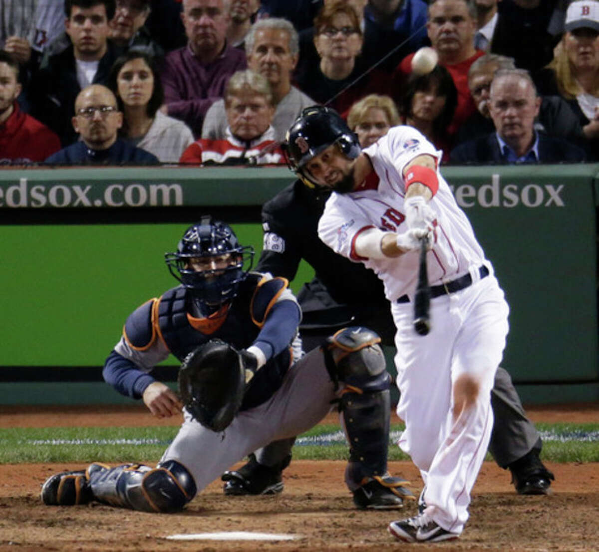 Boston Red Sox's Shane Victorino hits a grand slam against the Detroit Tigers in the seventh inning during Game 6 of the American League baseball championship series on Saturday, Oct. 19, 2013, in Boston. (AP Photo/Charlie Riedel)