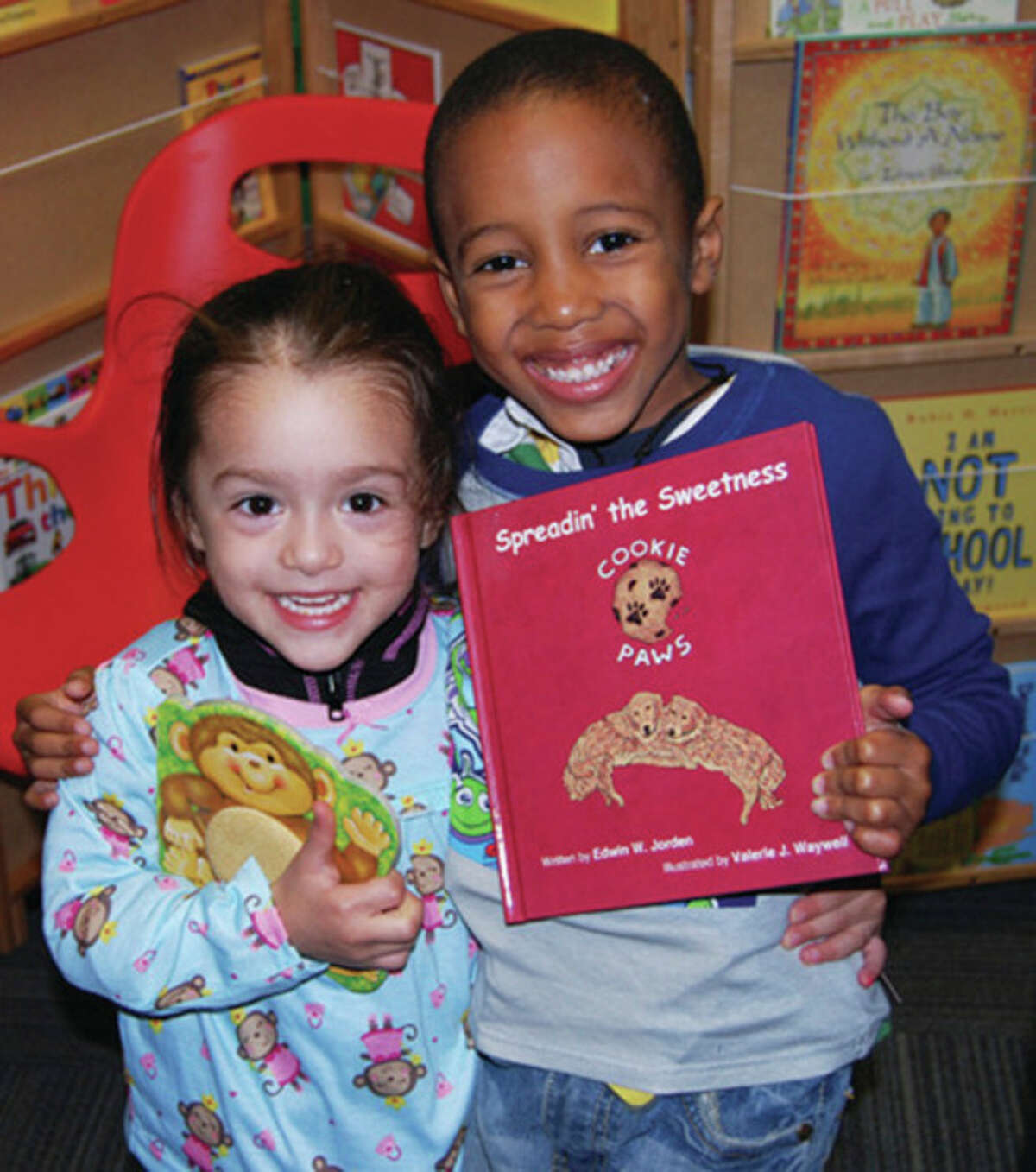 Contributed photos Children are all smiles after receiving new books and pajamas through the efforts of the Connecticut chapter of Pajama Program.