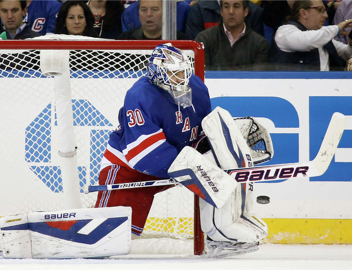 New York Rangers goalie Henrik Lundqvist of Sweden makes a save in the second period of their NHL hockey game against the Montreal Canadiens at Madison Square Garden in New York, Monday, Oct. 28, 2013. (AP Photo/Kathy Willens)