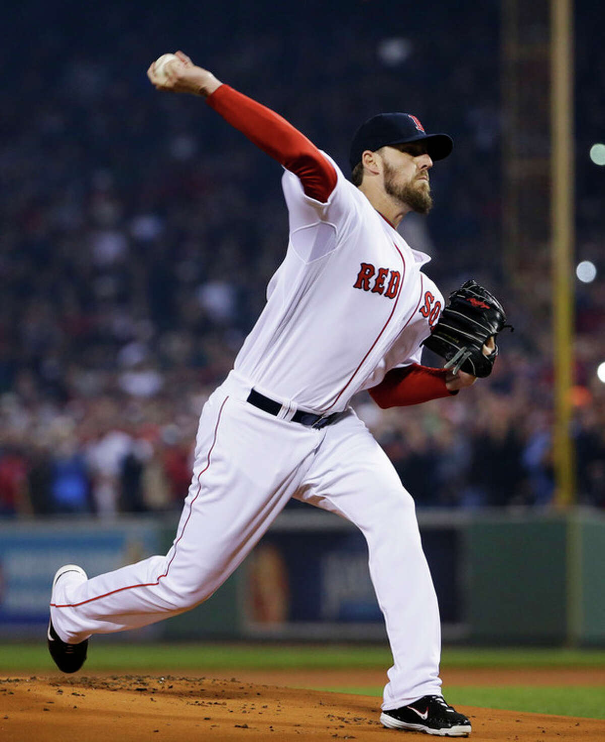 Boston Red Sox starting pitcher John Lackey throws during the first inning of Game 6 of baseball's World Series against the St. Louis Cardinals Wednesday, Oct. 30, 2013, in Boston. (AP Photo/Matt Slocum)