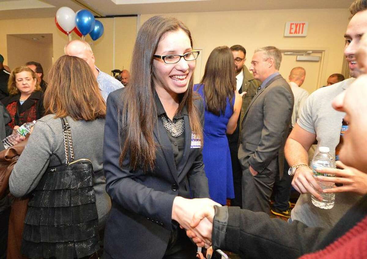 Hour Photo/Alex von Kleydorff . Eloisa Melendz shakes hands with supporters for her win on Election Night to the Common Council