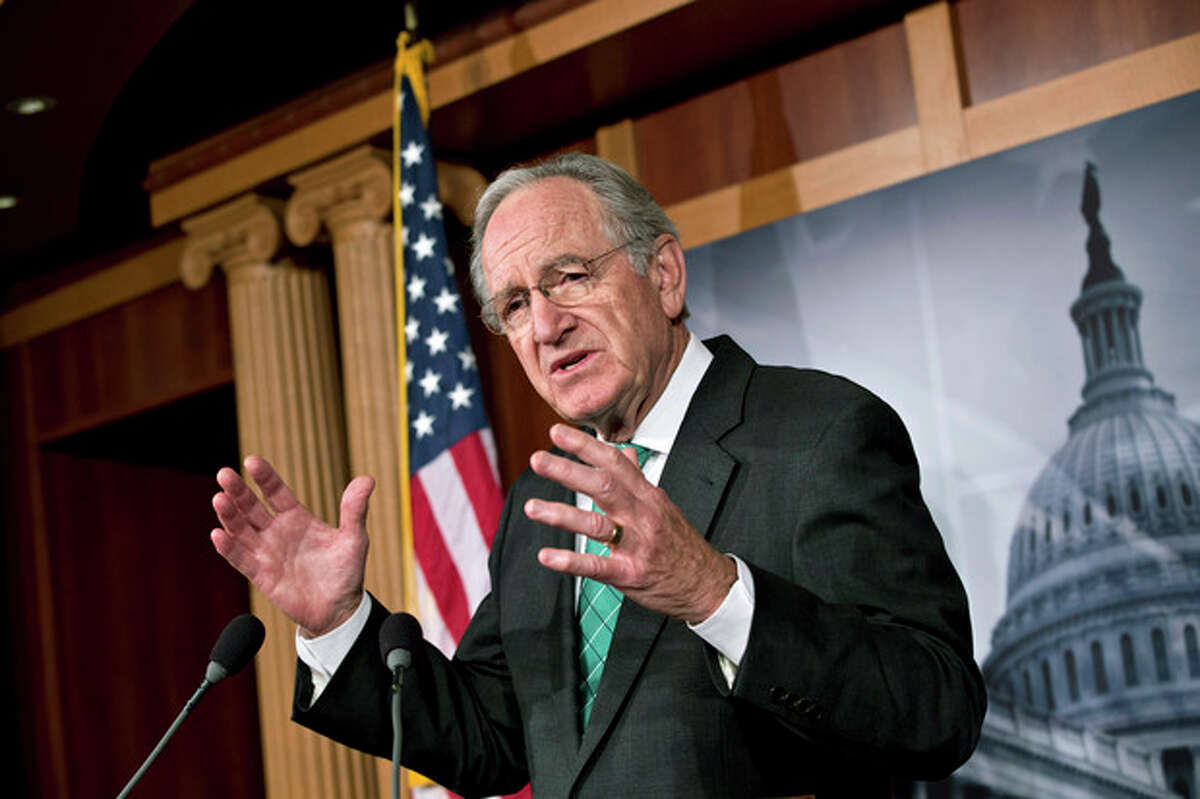 Sen. Tom Harkin, D-Iowa, chairman of the Health, Education, Labor, and Pensions Committee, talks to reporters after the Senate cleared a major hurdle and agreed to proceed to debate a bill that would prohibit workplace discrimination against gay, bisexual and transgender Americans, at the Capitol in Washington, Monday, Nov. 4, 2013. The bipartisan vote increases the chances that the Senate will pass the bill by week's end, but its prospects in the Republican-led House are dimmer. (AP Photo/J. Scott Applewhite)