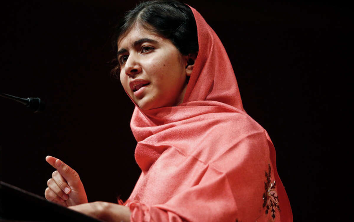 FILE - In this Friday, Sept. 27, 2013 file photo, Malala Yousafzai addresses students and faculty after receiving the 2013 Peter J. Gomes Humanitarian Award at Harvard University in Cambridge, Mass. A militant commander and an intelligence official say the Pakistani Taliban have chosen the man who planned the attack on teenage activist Malala Yousafzai as the group's new leader. (AP Photo/Jessica Rinaldi, File)