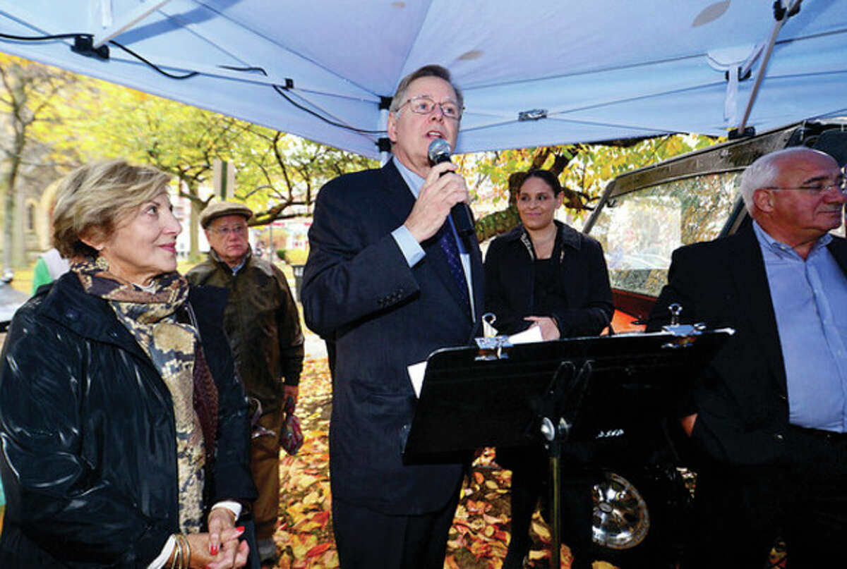 Hour photo / Erik Trautmann President of Stamford Downtown Special Services Division Sandy Goldstein looks on as mayor-elect David Martin speaks to the balloon handlers Thursday during the annual press conference announcing Stamford's Thanksgiving Parade.