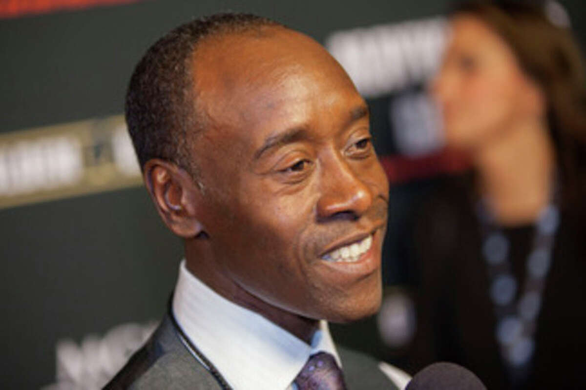 FILE - In a Saturday, Sept. 14, 2013 file photo, Don Cheadle arrives at the VIP Pre-Fight Party for the One: Mayweather vs. Canelo Fight at the MGM Grand Garden Arena in Las Vegas. Don Cheadle will play Miles Davis in a biopic the actor has long planned on the innovative jazz pioneer. BiFrost Pictures told The Associated Press on Wednesday, Nov. 13, 2013 that it will finance and produce Kill the Trumpet Player, with Cheadle also making his directorial debut. Production is finally set to begin in June.(Photo by Eric Jamison/Invision/AP, File)
