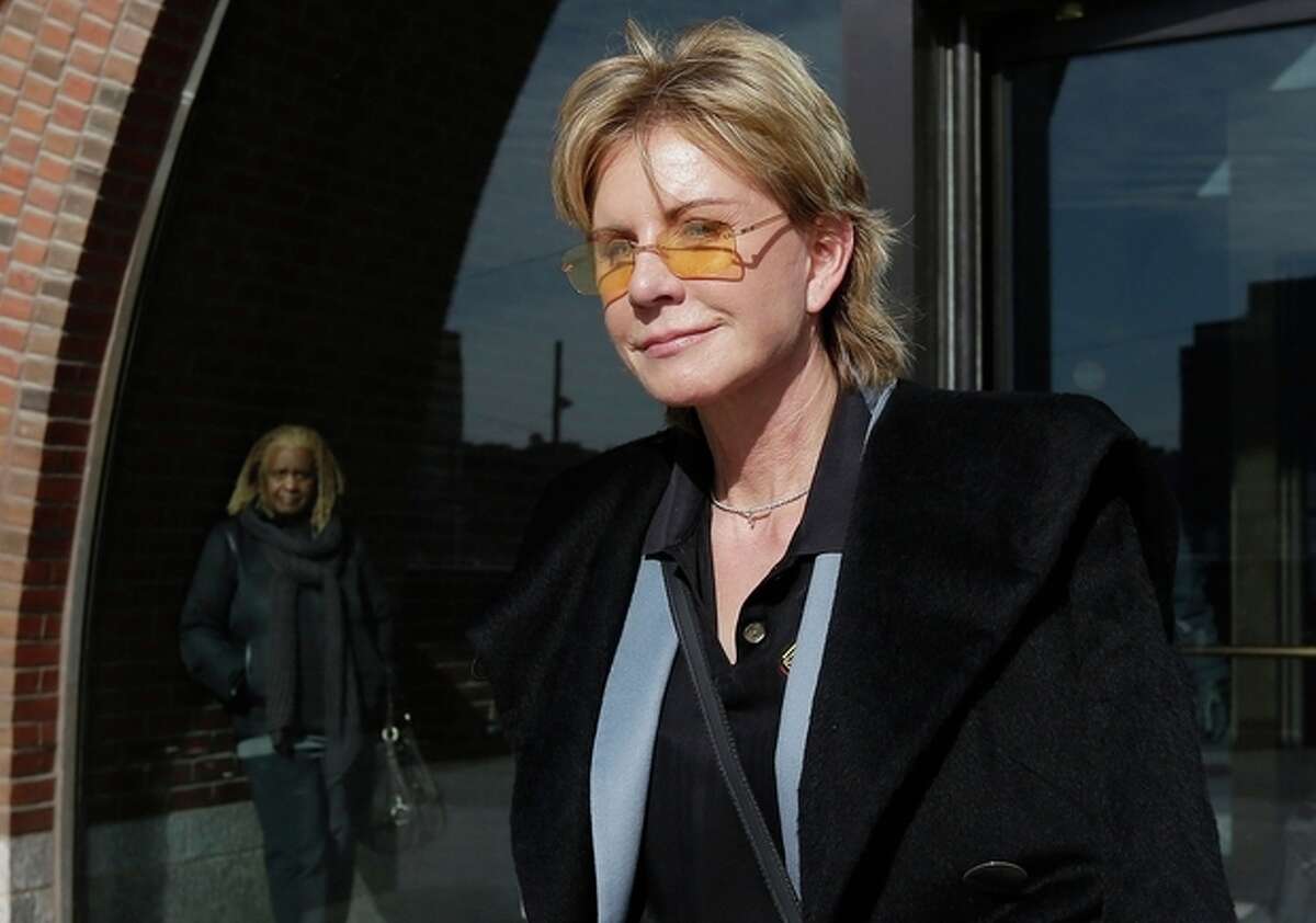 AP Photo/Steven Senne, File In a Feb. 7, file photo, author Patricia Cornwell leaves federal court in Boston after she took the stand in her lawsuit against her former financial management company. Cornwell's 21st Scarpetta novel, "Dust" has just been published.