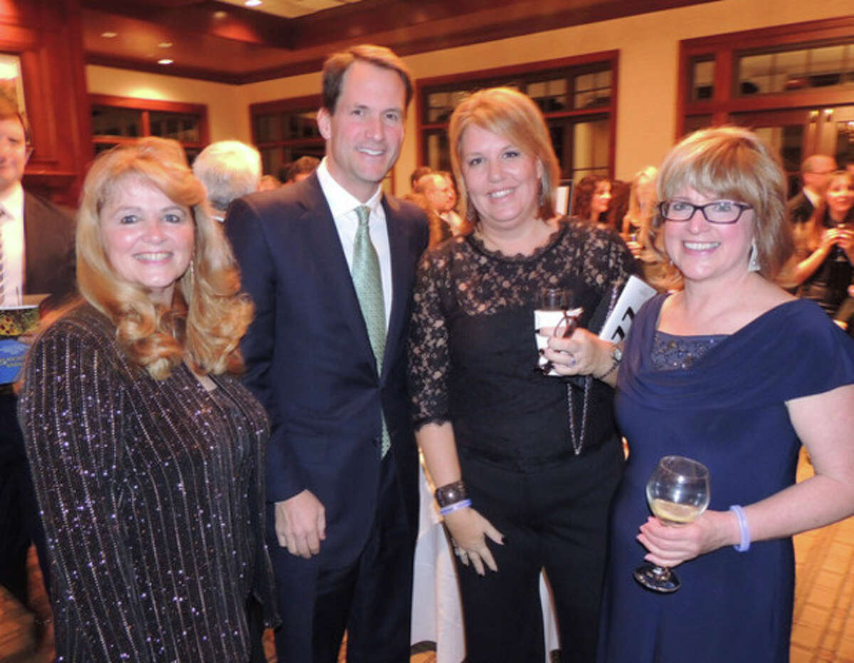 Contributed photo At left, Auctioneer June Delair with Congressman Jim Himes, Katrina O'Connor of Darien and STAR Executive Director Katie Banzhaf.