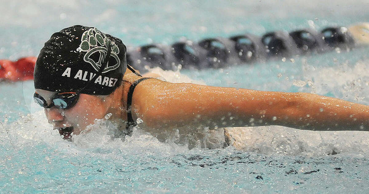 Hour photo/John Nash Alexis Alvarez of Norwalk-McMahon competes in the 200 IM during Tuesday's Class LL state championship meet.