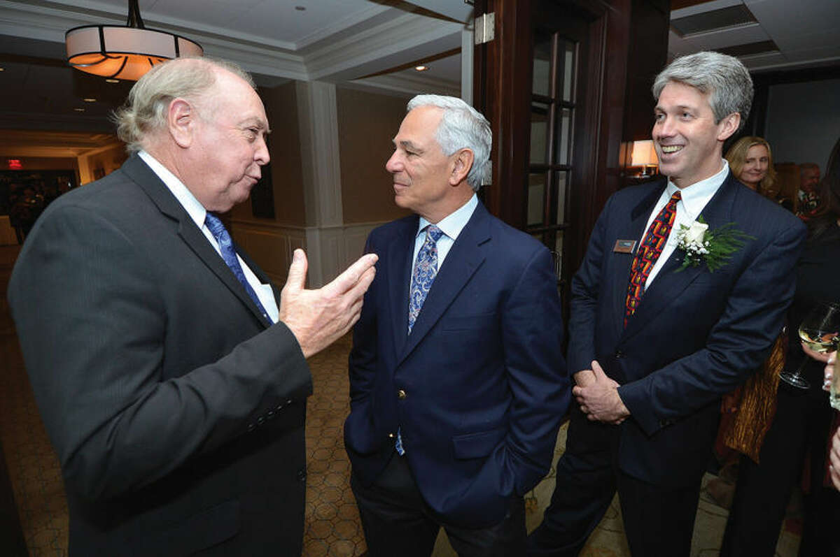 Wilton Business Person of the Year Stephen Summerton chats with Bobby Valentine with Tierney O'Hearn, the newly-elected president of the Wilton Chamber of Commerce, during the 24th annual dinner at Rolling Hills Country Club. 