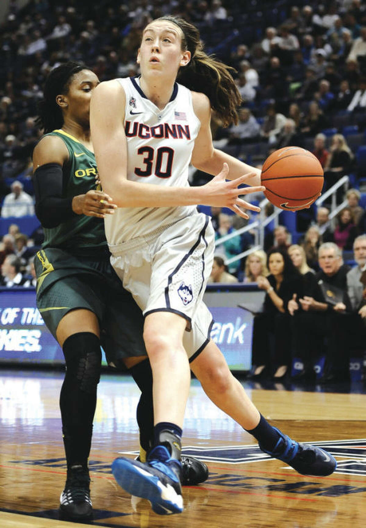 AP photo UConn's Breanna Stewart, right, drives past Oregon's Chrishae Rowe during Wednesday night'sgame at the XL Center. Stewart had a game-high 28 points for the top-ranked Huskies in their 114-68 victory over the Ducks.