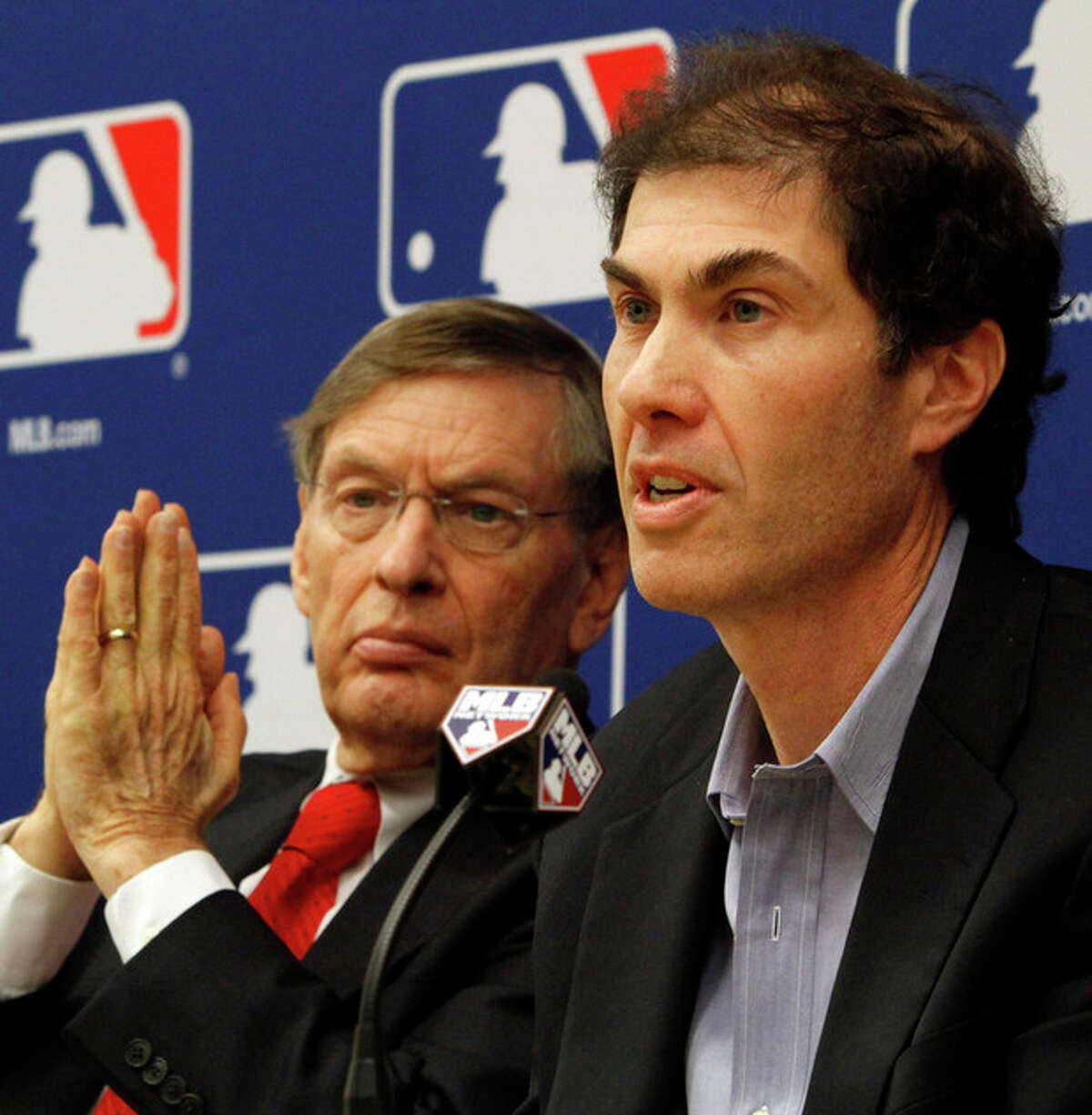 FILE - In this Nov. 22, 2011, file photo, Major League Baseball Commissioner Bud Selig, left, and MLB Players Association Executive Director Michael Weiner hold a news conference announcing a five-year collective bargaining agreement in New York. Weiner, the plain-speaking, ever-positive labor lawyer who took over as head of the powerful baseball players' union four years ago and smoothed the group's perennially contentious relationship with management, died Thursday, Nov. 21, 2013, 15 months after announcing he had been diagnosed with an inoperable brain tumor. He was 51. (AP Photo/Bebeto Matthews, File)
