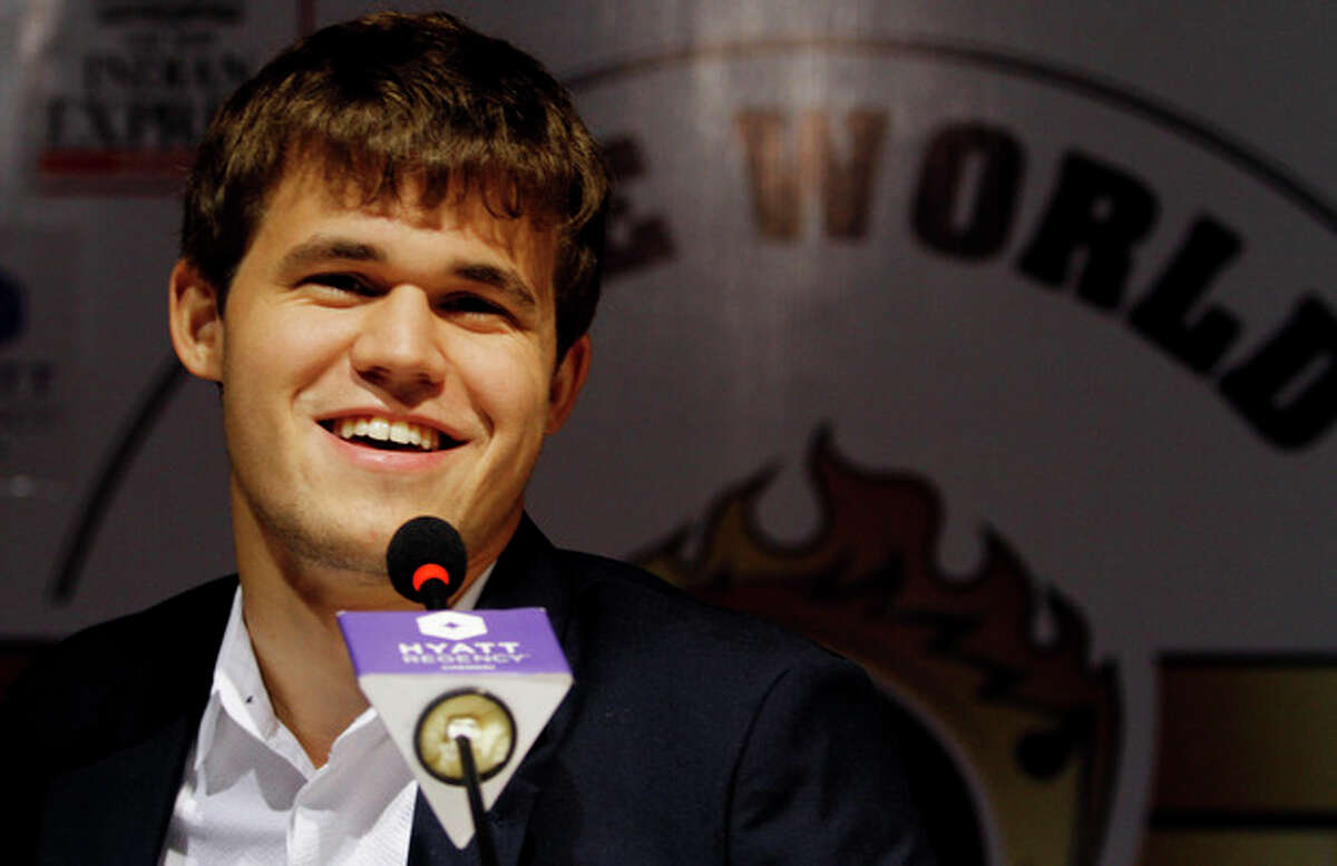 Norway?’s Magnus Carlsen smiles as he answers a question during a press conference after winning the match against India?’s Viswanathan Anand during the Chess World Championship match in Chennai, India, Friday, Nov. 22, 2013. Anand?’s reign as the world champion came to an end Friday after Carlsen took the crown in the tenth game of the the World Chess championship. (AP Photo/Arun Sankar K.)