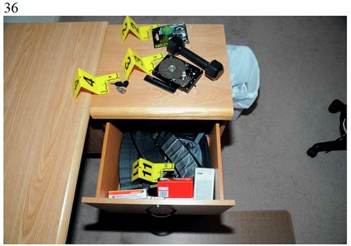 This image contained in the appendix of a summary report on the shootings at Sandy Hook Elementary School and 36 Yogananda St., in Newtown, Conn., on Dec. 14, 2012, and released Monday, Nov. 25, 2013, by the Danbury, Conn., State’s Attorney shows a scene at 36 Yogananda St., where gunman Adam Lanza lived with his mother in Newtown, Conn. Lanza opened fire inside the school killing 20 first-graders and six educators before killing himself as police arrived. (AP Photo/Office of the Connecticut State's Attorney Judicial District of Danbury)