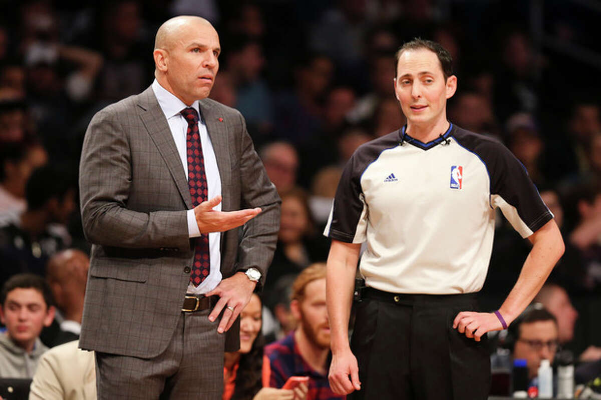 Brooklyn Nets head coach Jason Kidd, left, argues with referee Marat Kogut in the second half of an NBA basketball game against the Los Angeles Lakers at the Barclays Center, Wednesday, Nov. 27, 2013, in New York. The Lakers defeated the Nets 99-94. (AP Photo/John Minchillo)