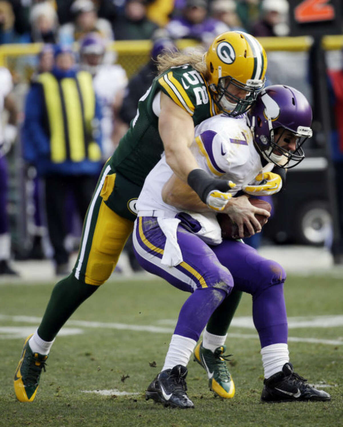 Green Bay Packers' Clay Matthews sacks Minnesota Vikings quarterback Christian Ponder during the first half of an NFL football game Sunday, Nov. 24, 2013, in Green Bay, Wis. (AP Photo/Mike Roemer)