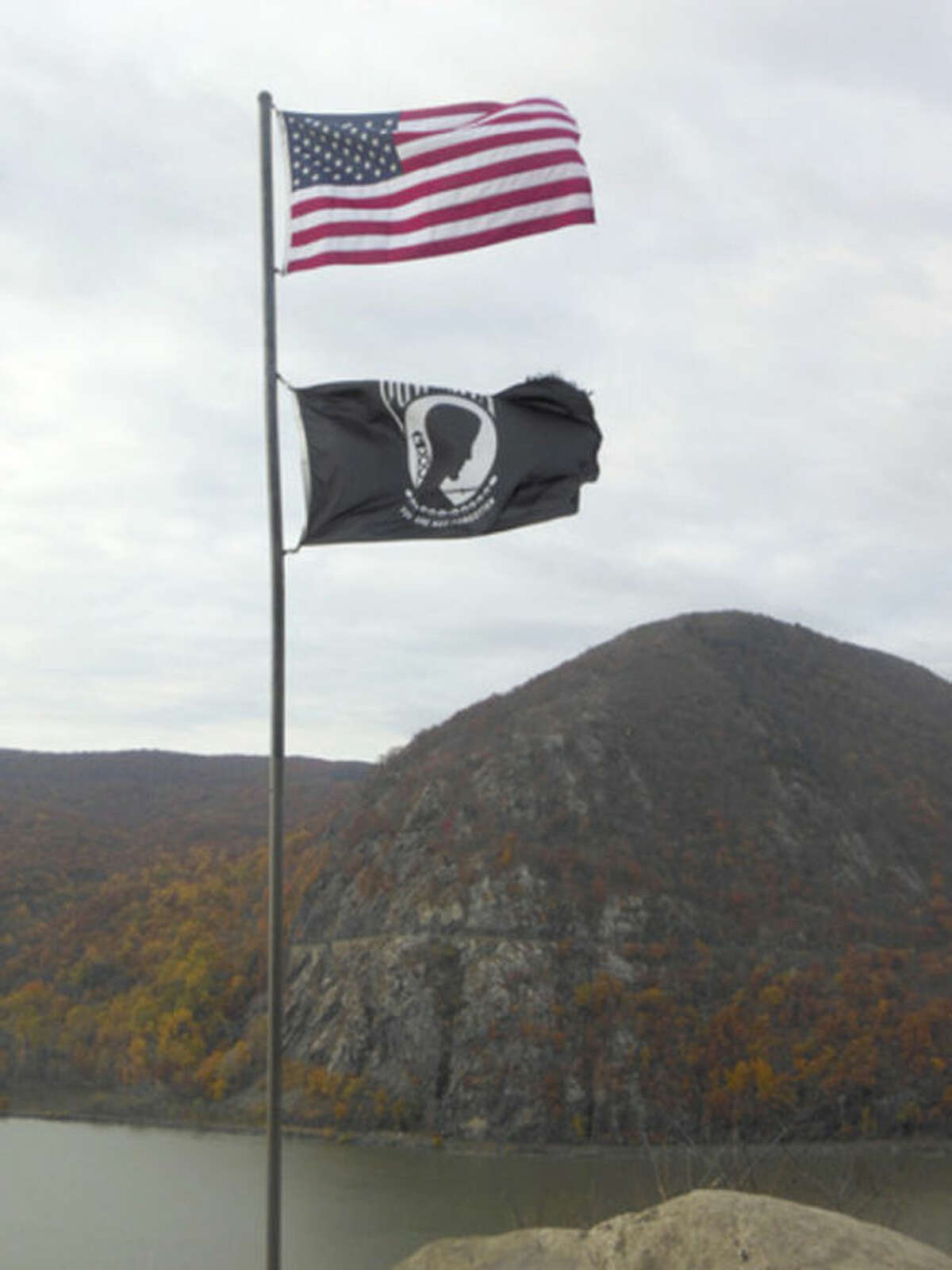 Photo by Marjorie McWilliams Flags in front of Storm King Mountain.