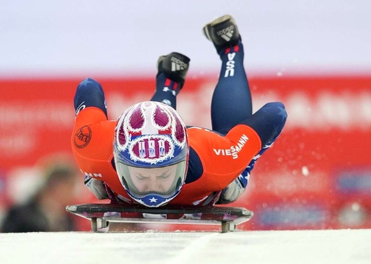 USA' Noelle Pikus-Pace heads down the course during women's World Cup skeleton competition in Calgary, Alberta, Friday, Nov. 29, 2013. (AP Photo/The Canadian Press, Larry MacDougal)