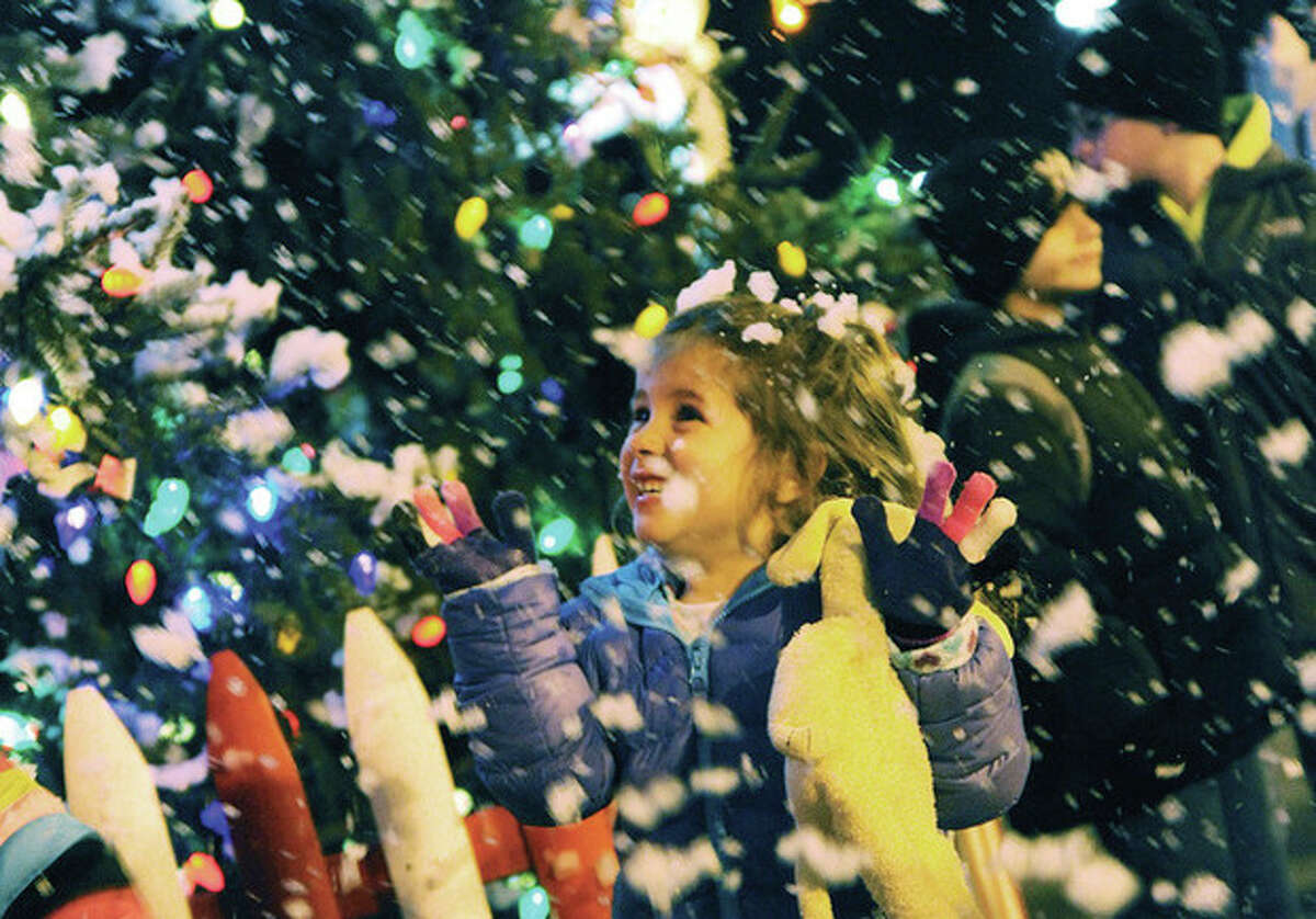 Luciana DiDodo 4, enjoys the Stew Leonards annual Christmas Tree lighting and the snow machine Tuesday night. Hour photo/Matthew Vinci