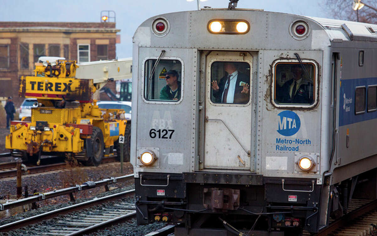 A Metro-North passenger train that is pushed by a locomotive rolls towards the Spuyten Duyvil station in the Bronx borough of New York Wednesday, Dec. 4, 2013, just passing the area where a fatal derailment disrupted service on the Hudson Line of the railroad Sunday, Dec. 1. The line was running at ninety eight percent capacity Wednesday, according to Metro-North. (AP Photo/Craig Ruttle)