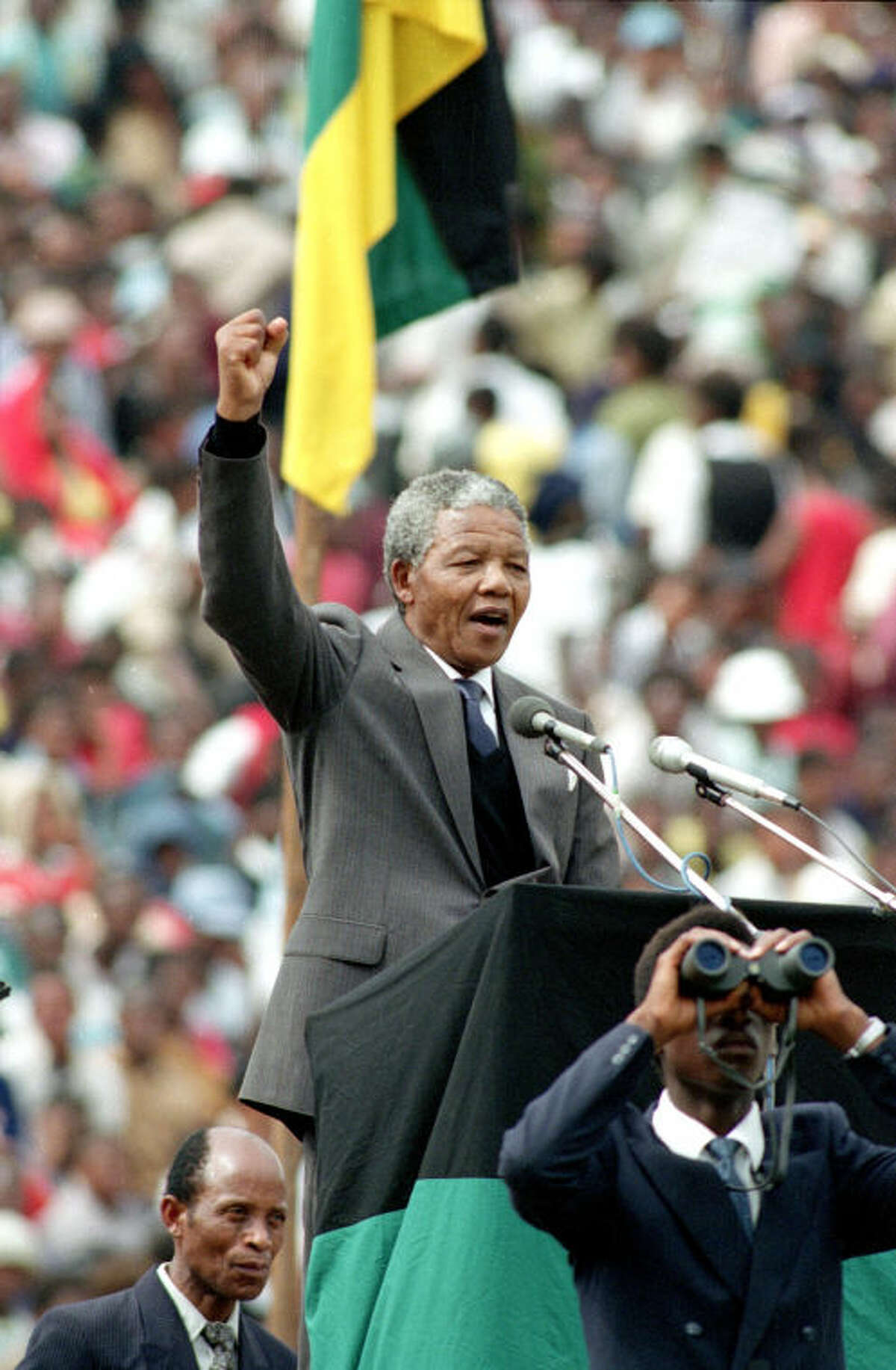 FILE - In this Feb. 13, 1990, file photo, African National Congress leader Nelson Mandela gives the black power salute to 120,000 ANC supporters packing Soccer City stadium in the Soweto township of Johannesburg, South Africa, shortly after his release from 27 years in prison. South Africa's president says, Thursday, Dec. 5, 2013, that Mandela has died. He was 95. (AP Photo, File)